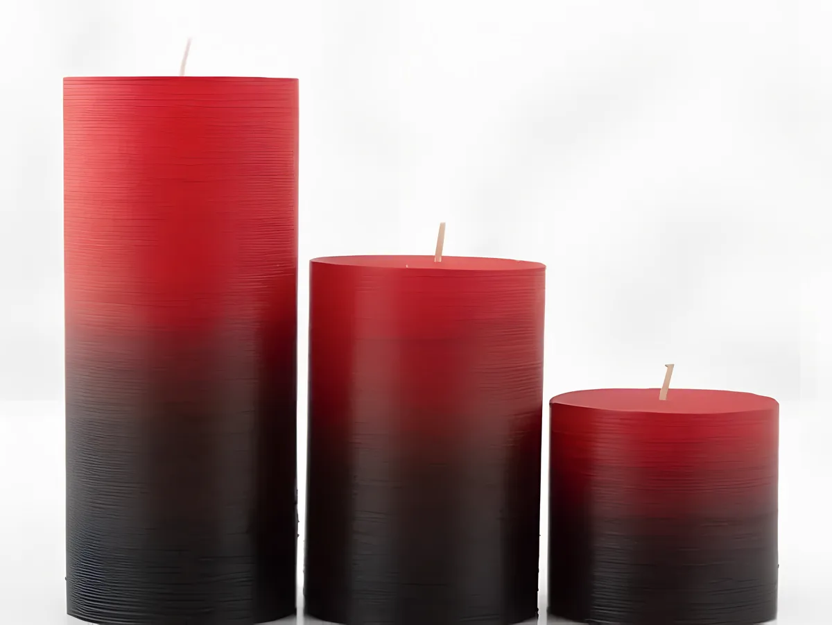 Sfumato: three pillar candles in a red-to-black gradient